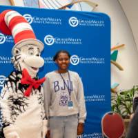 Student poses with Cat in the Hat